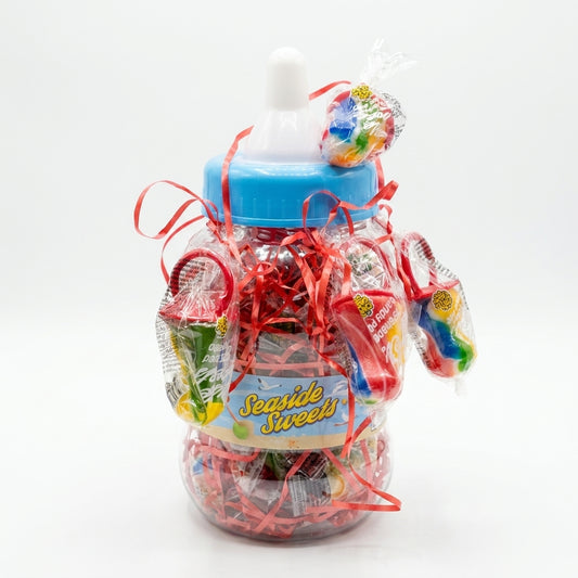 Krazy Kandi Dummy Pops Fruit Flavour Hard Rock Dummies in Giant Tub 1950g displayed on a traditional wooden counter in a classic British sweet shop setting