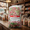 Bebeto Fizzy Watermelon Slices 2kg displayed on a traditional wooden counter in a classic British sweet shop setting