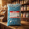 Bebeto Fizzy Blue Raspberry Pencil Bites 2kg displayed on a traditional wooden counter in a classic British sweet shop setting