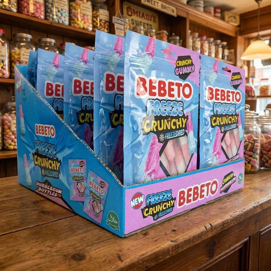 Bebeto 12 x Freeze Dried Bubblegum Bottles 420g displayed on a traditional wooden counter in a classic British sweet shop setting