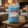 Bebeto Fizzy Blue Raspberry Pencil Bites 2kg on a coffee table in a cosy home living room setting
