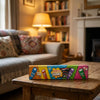 Bebeto Giant Pencils 400g on a coffee table in a cosy home living room setting