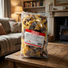 Bebeto Giant Fizzy Cola Bottles 2kg on a coffee table in a cosy home living room setting