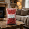 Bebeto Strawberry Pencil Bites 2kg on a coffee table in a cosy home living room setting