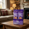 Cadburys High Lights Milk Chocolate Drink 30 x 11g Sachets on a coffee table in a cosy home living room setting
