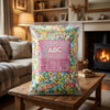 Cander ABC Letters 2.5kg on a coffee table in a cosy home living room setting