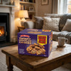 House Of Lancaster Chunky Chocolate Cookies 1kg on a coffee table in a cosy home living room setting
