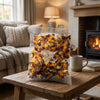 Aladdins Cola Bottles 1kg on a coffee table in a cosy home living room setting