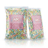 Two packs of Cander ABC Letters 2.5kg commercial marketing layout on a reflective white surface