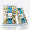 Two packs of Haribo Fried Eggs 1kg commercial marketing layout on a reflective white surface